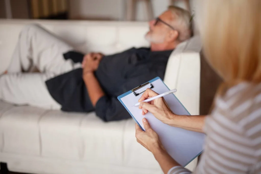 Mature male patient during hypnotherapy session